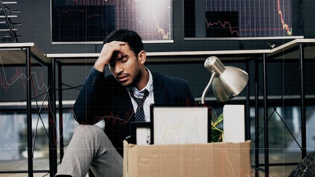 Failure should be our teacher, not our undertaker. Shot of a young businessman looking depressed after being retrenched from work in a office.