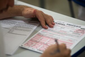 person filling on application form