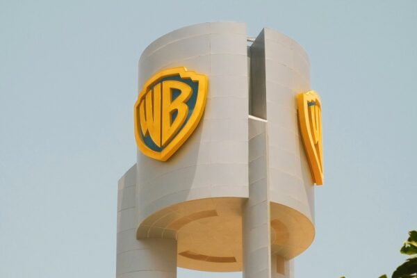 A large white building with a yellow logo on it