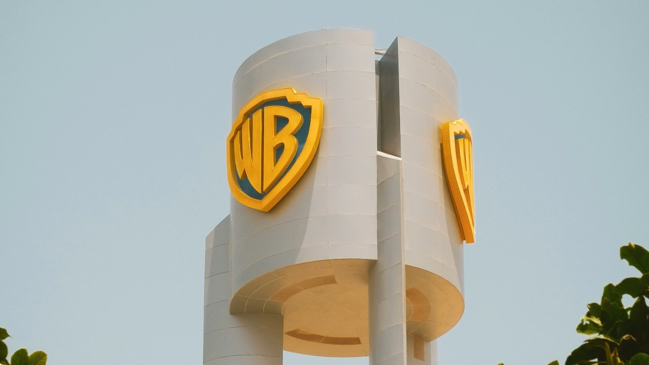 A large white building with a yellow logo on it