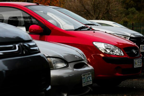 a row of parked cars in a parking lot