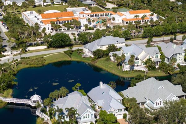 Expensive residential houses in small town Boca Grande Florida American dream homes as example of real estate development in US suburbs