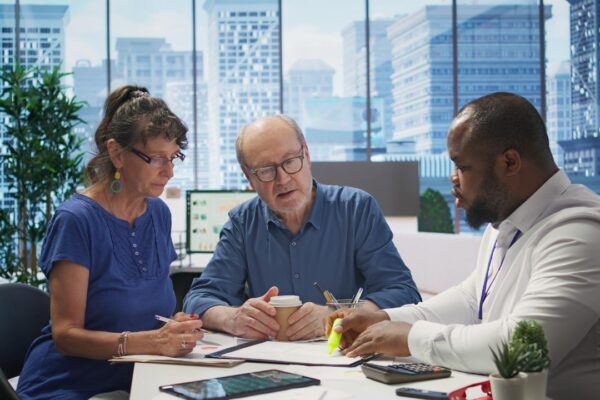 Mature couple receiving professional advice on retirement planning