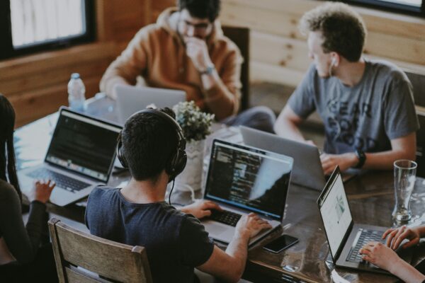 group of people using laptop computer